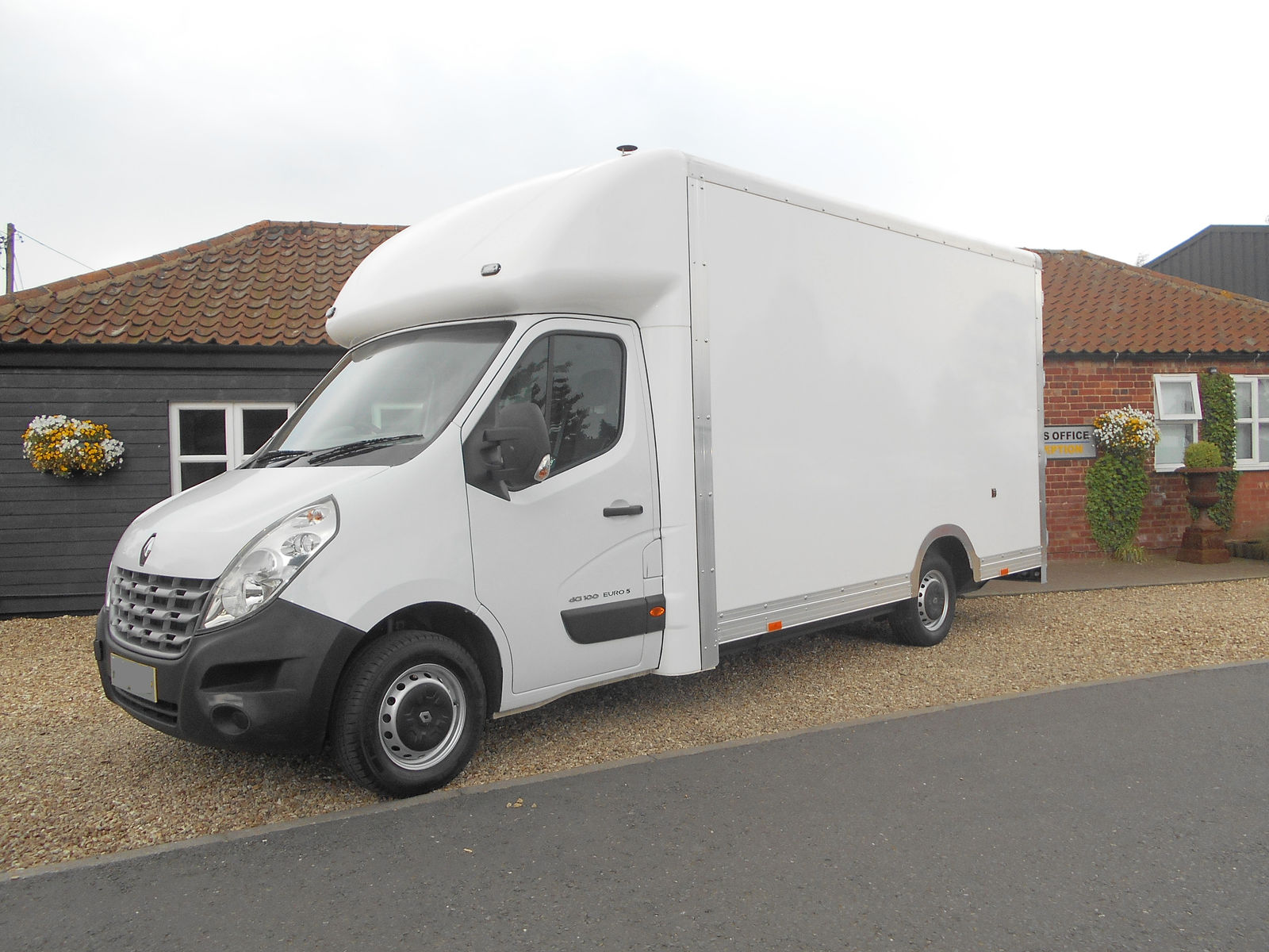 Clearance van parked on a gravel drive